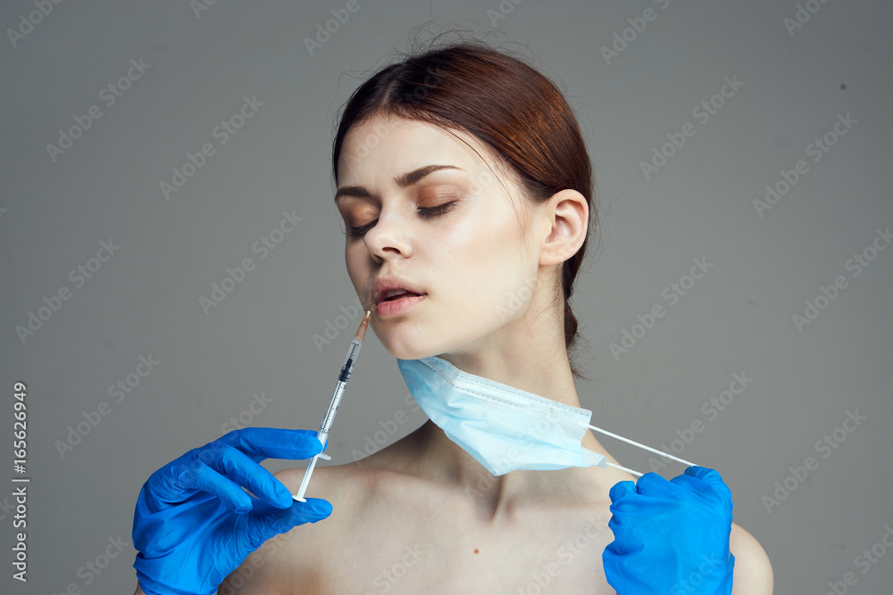 Beautiful young woman on a black background, doctor, medicine Beautiful young woman on a black background, doctor, medicine