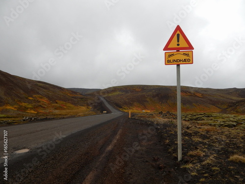 Dangerous road yellow sign