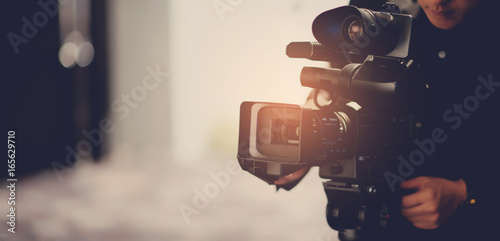 Video camera / videographer close up / cameraman / movie photo