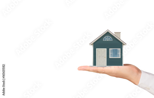 Mortgage concept by house from hand