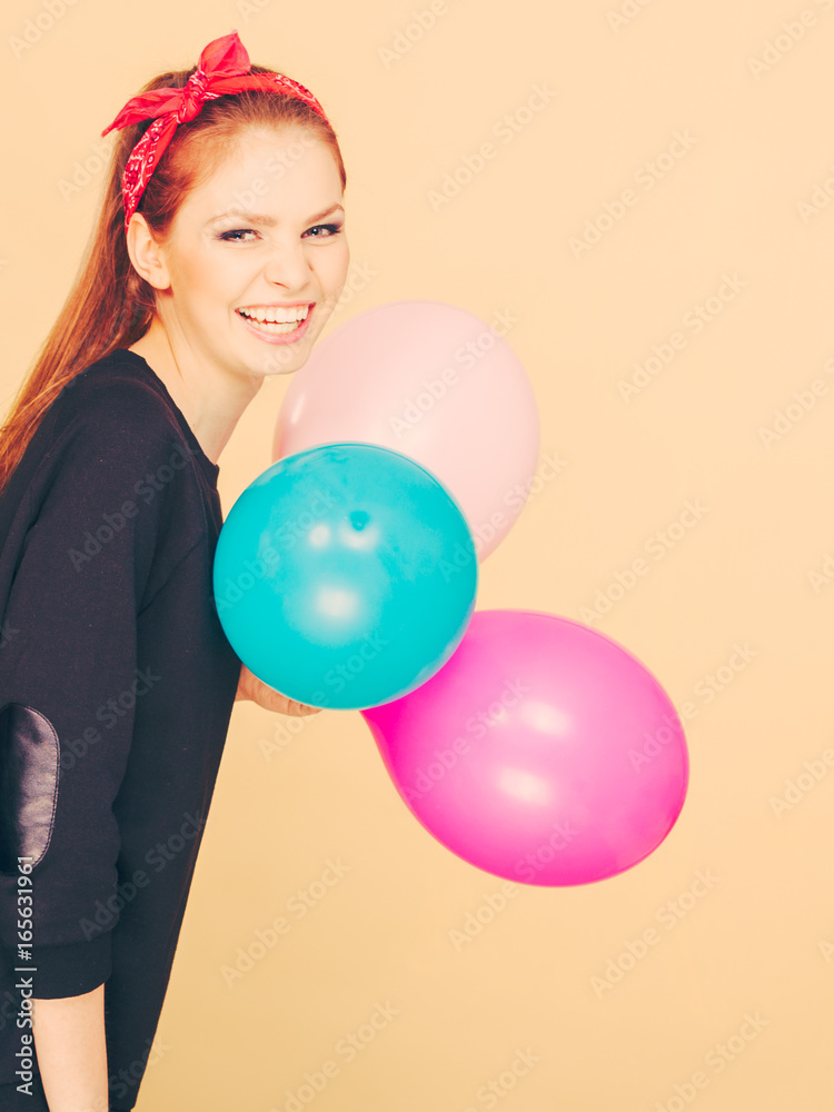 Smiling crazy girl having fun with balloons. Smiling crazy girl having fun with balloons.