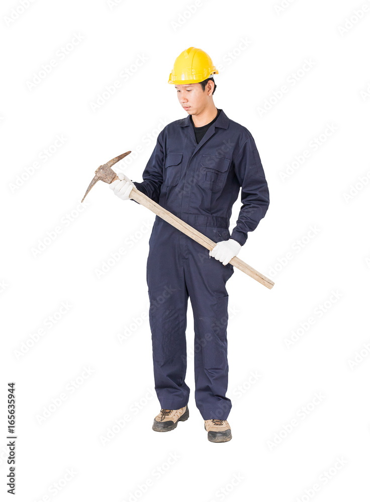 Man in uniform hold old pick mattock that is a mining device Man in uniform hold old pick mattock that is a mining device
