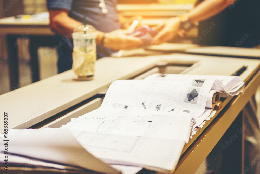 Blur Old construction drawings on an office desk, Architectural plans