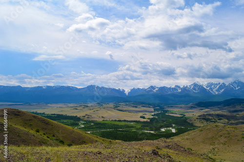 Landscape of snow peaks of North-Chuyski ridge, Kurai steppe and Chuya river in Altai mountains. Altay Republic, Siberia, Russia.