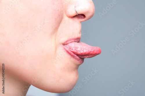 Girl showing tongue out of mouth