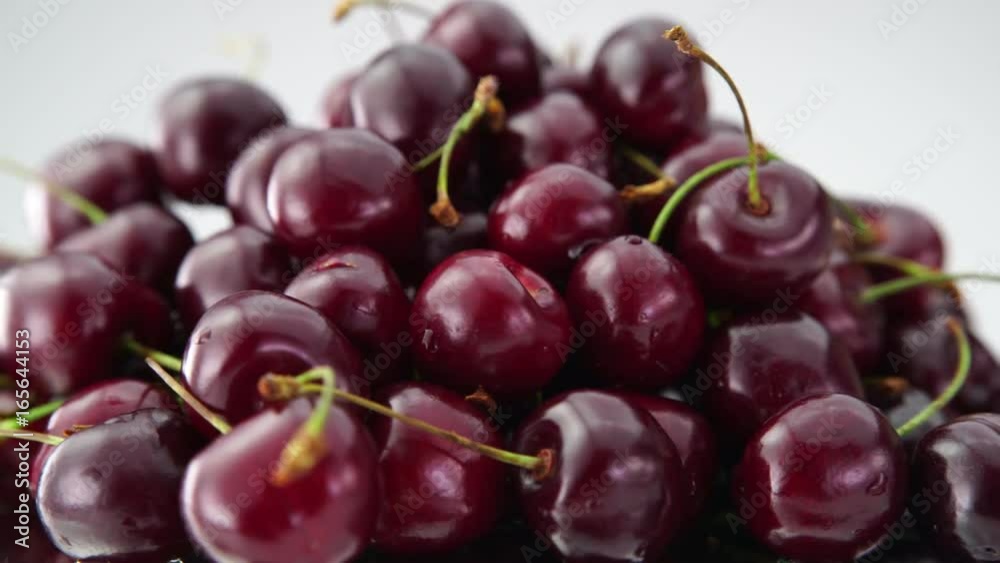 Heap of fresh cherries rotate on white background. (4K, HD, high definition 1080p). Healthy food concept. Heap of fresh cherries rotate on white background. (4K, HD, high definition 1080p). Healthy food concept.