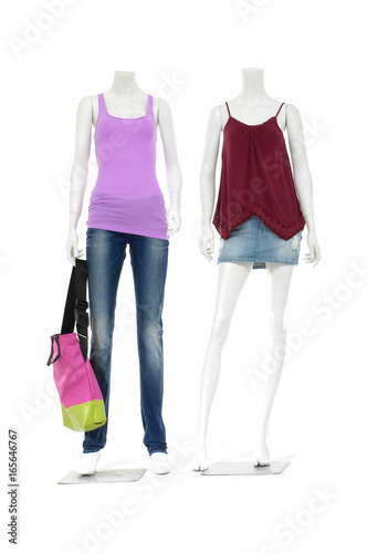 full-length twofemale mannequin colorful shirt dressed in jeans pants with bag
