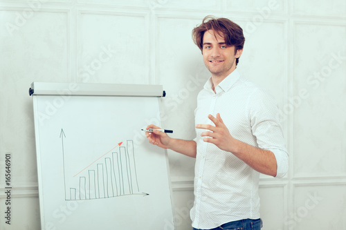 man presenting by the flipchart