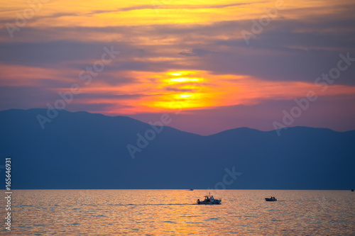Sunset with boats at sea