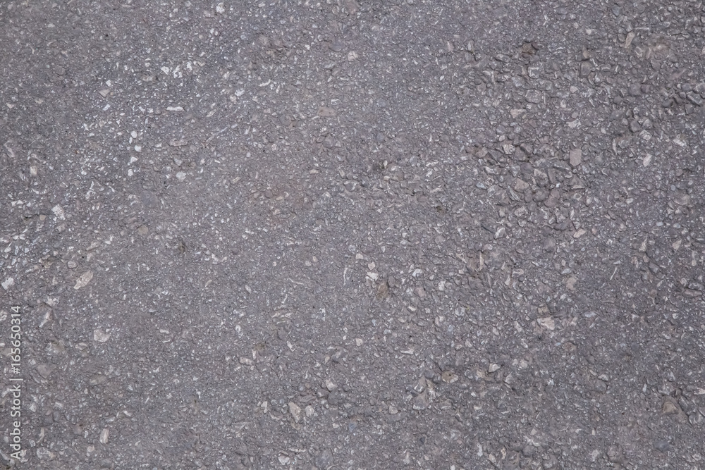 background texture of rough asphalt.A smooth dark grey asphalt pavement texture with small rocks.Asphalt texture background texture of rough asphalt.A smooth dark grey asphalt pavement texture with small rocks.Asphalt texture