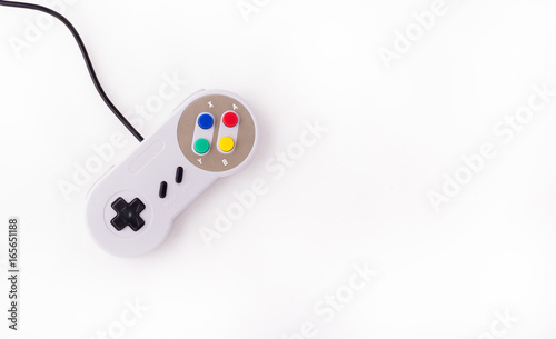 Obraz na płótnie Gray retro joystick on a white background. Video game console GamePad on a white background. Top view w salonie