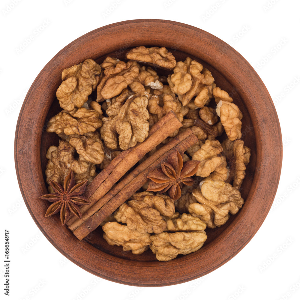 Walnuts shelled in a bowl isolated on white background. Walnuts shelled in a bowl isolated on white background.