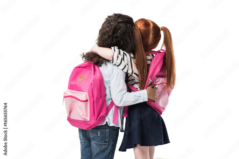 back view of cute multiethnic schoolgirls with backpacks standing together isolated on white back view of cute multiethnic schoolgirls with backpacks standing together isolated on white
