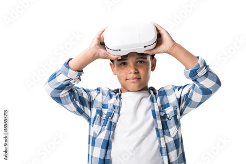 african american boy wearing virtual reality headset and looking at camera isolated on white