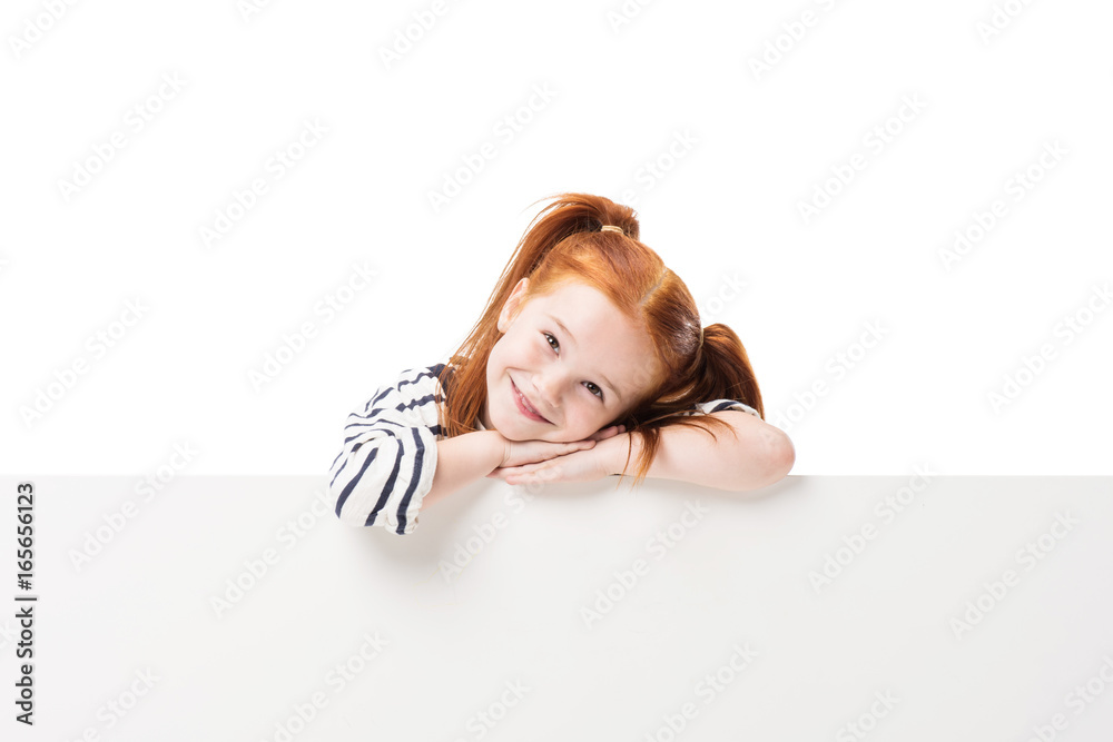 adorable happy little redhead girl posing with blank banner isolated on white adorable happy little redhead girl posing with blank banner isolated on white