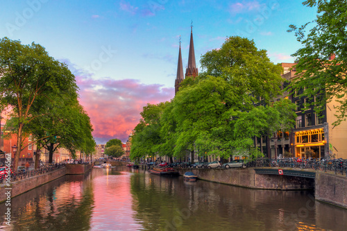 Photography Beautiful sunset at the Singel canal in Amsterdam with the Krijtberg church and