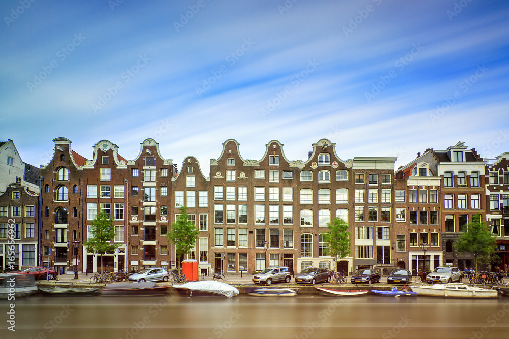 Beautiful long exposure of the canal houses at the UNESCO world heritage Prinsengracht canal in Amsterdam
