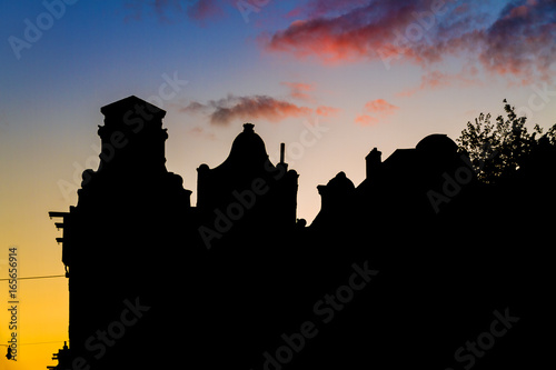 Beautiful silhouettes of canal houses at the little nine streets in Amsterdam, the Netherlands, at sunset