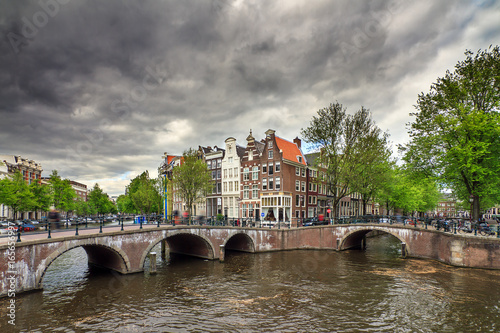 Beautiful clouds at the Emperors canal (Keizersgracht) and Leidse canal in Amsterdam in spring 