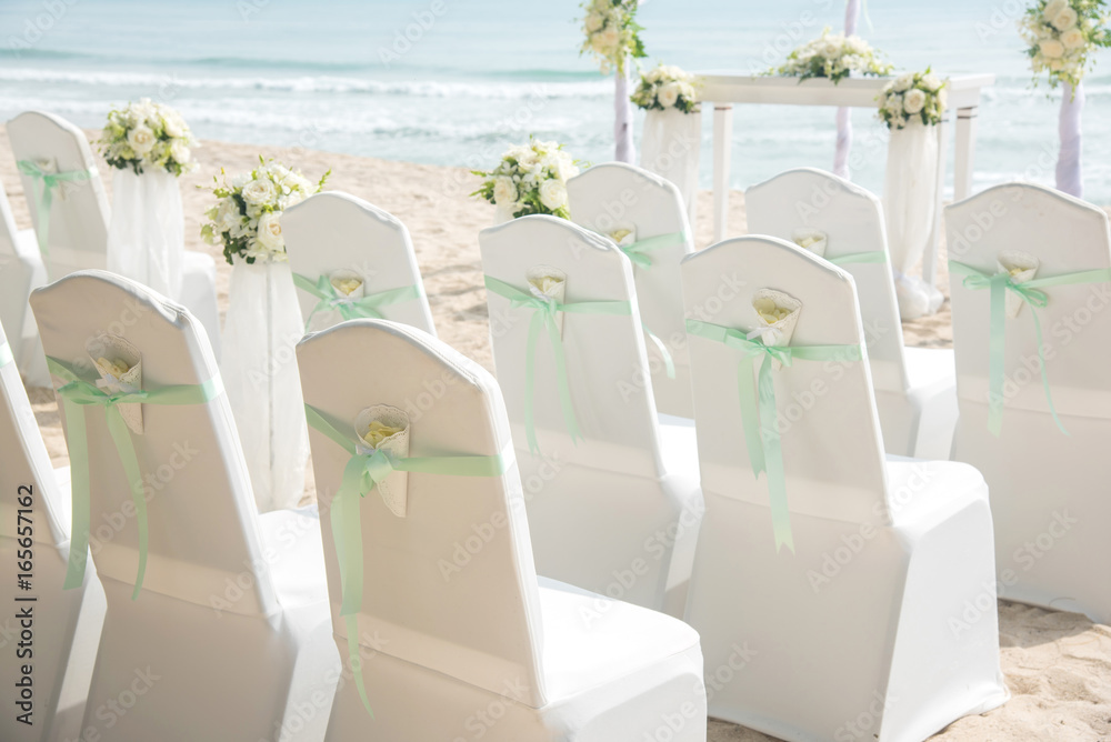 Wedding chair decorated with flowers.