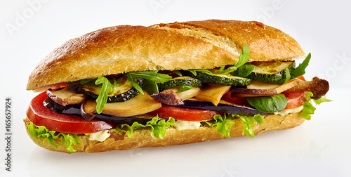 Fresh baguette sandwich with vegetables photo