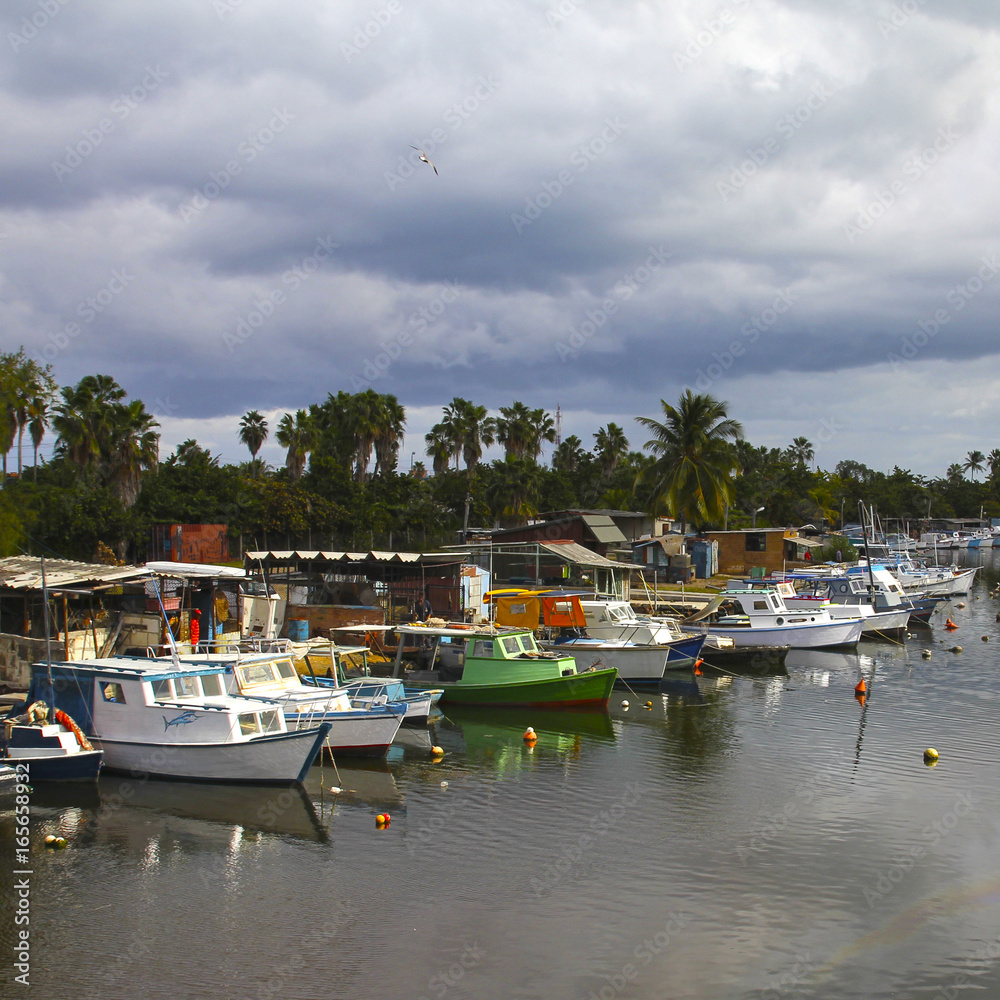Εκτύπωση καμβά Parking of fishing boats on the river. Square frame.