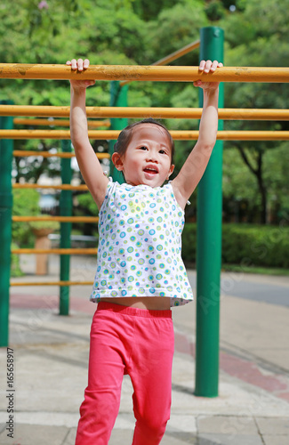 Little child girl exercise outdoor.