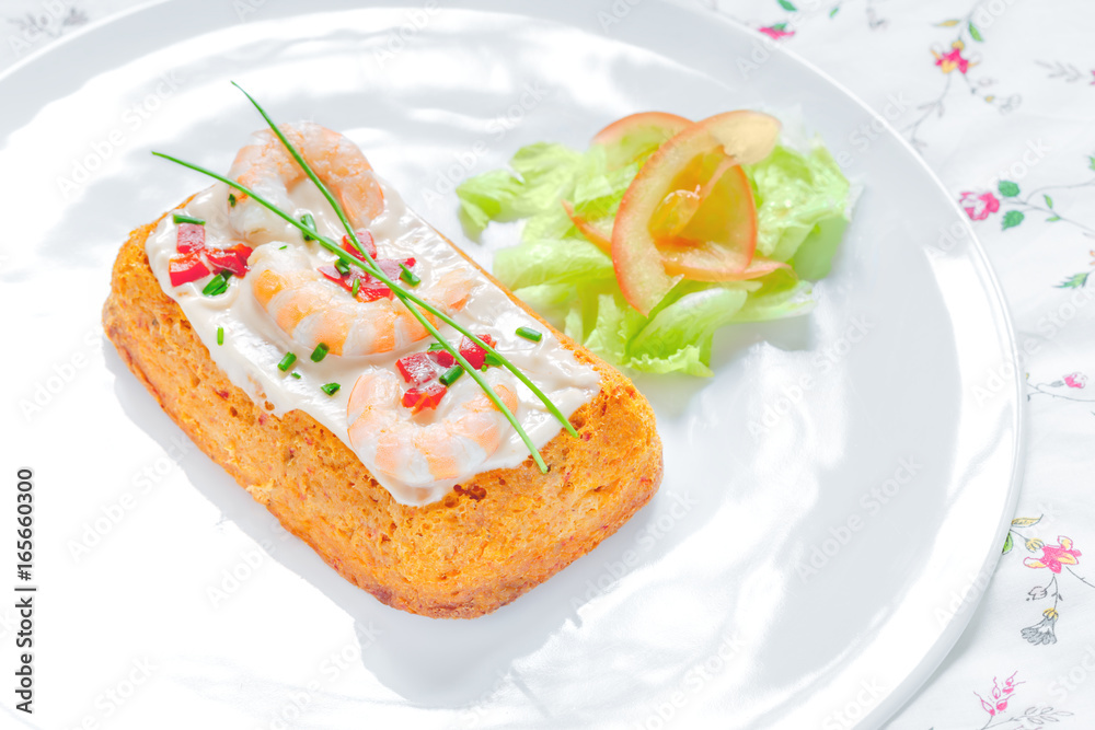 Delicious spanish Fish cake. Hake cake with tuna, tomato, shrimps, chive and salad cream. Delicious spanish Fish cake. Hake cake with tuna, tomato, shrimps, chive and salad cream.