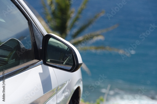 White car parked at the end of the road to Pololu point © Dmitri Kotchetov
