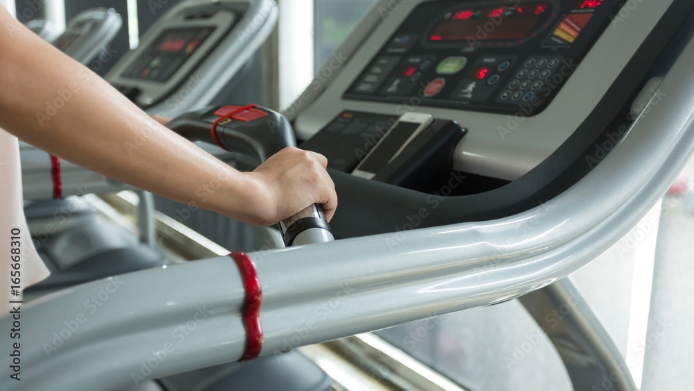 woman jogging and running on treadmill cardio machine