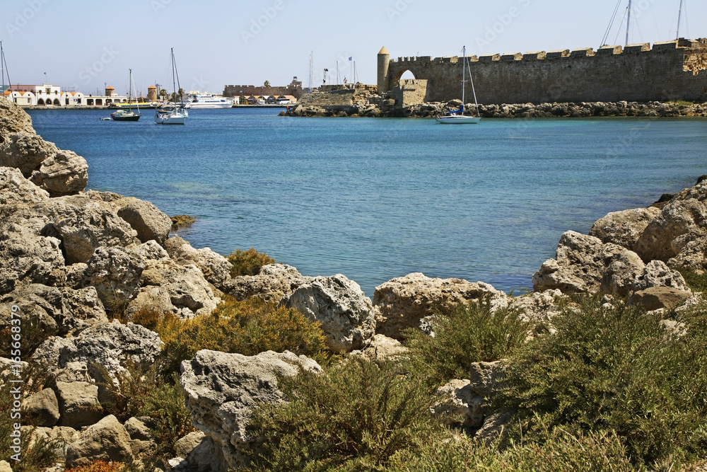 Mandraki harbour in Rhodes city. Rhodes island. Greece