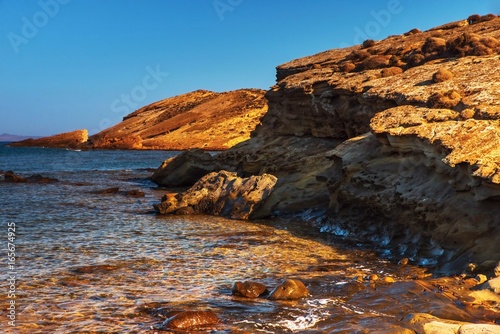 Fototapeta Naklejka Na Ścianę i Meble -  Transparent clear sea water, pebble and reef. Island Lemnos, Greece.