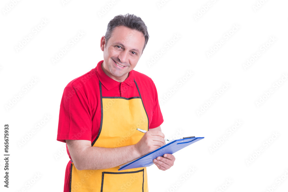 Male staff writing on clipboard in supermarket Male staff writing on clipboard in supermarket