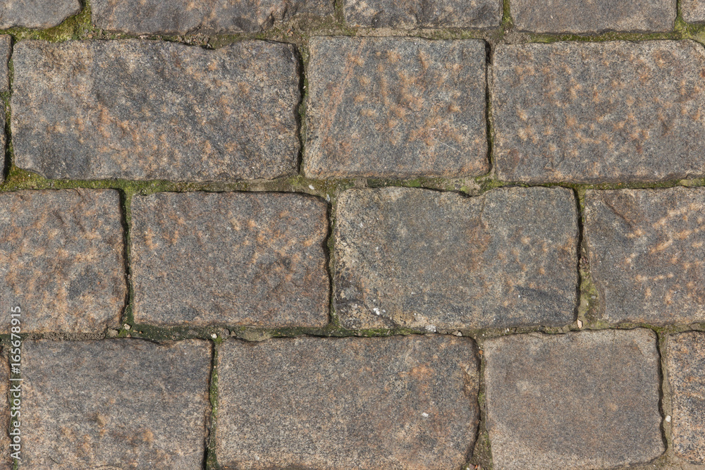 Ancient paving road in the center of the city close up Ancient paving road in the center of the city close up