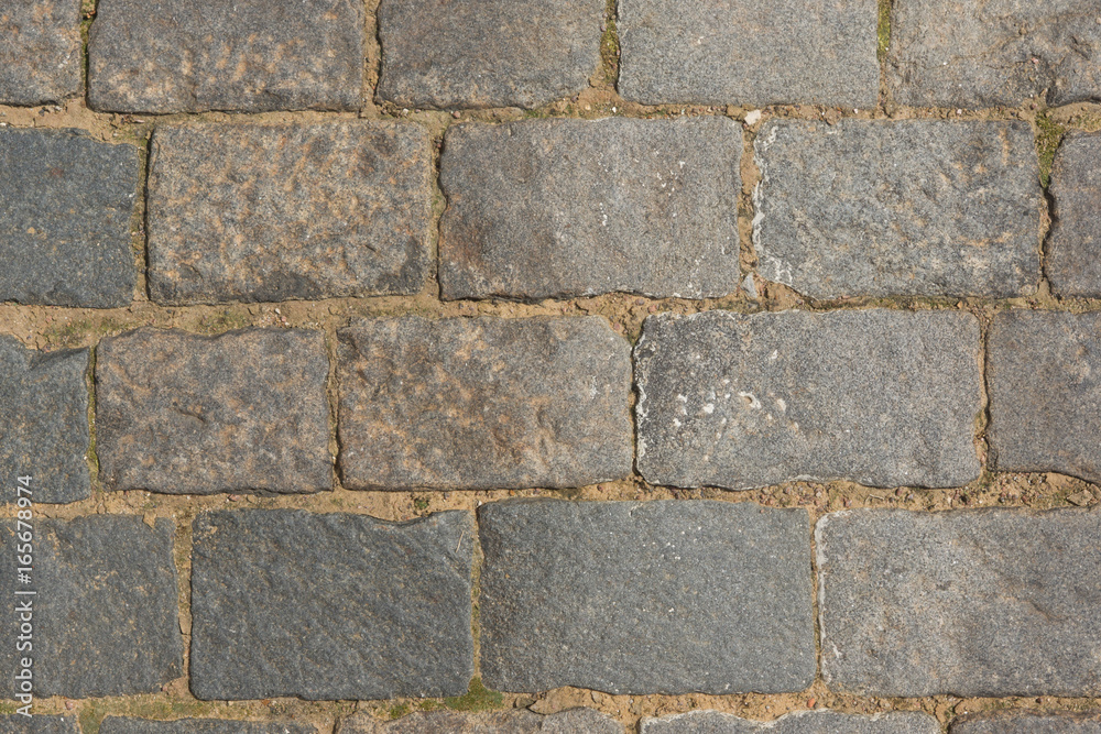 Ancient paving road in the center of the city close up Ancient paving road in the center of the city close up