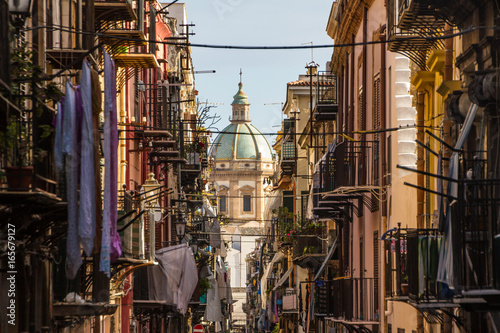 View at the church of San Matteo located in heart of Palermo, Italy, Europe. Traditional Italian medieval city center with typical narrow residential street.