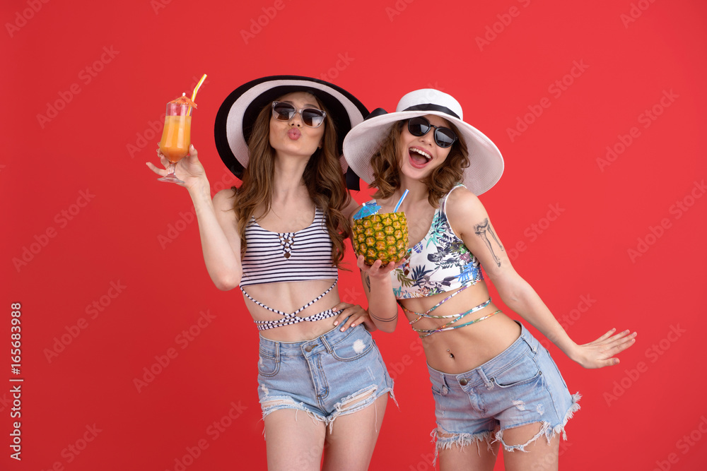 Happy two women drinking cocktails. Happy two women drinking cocktails.