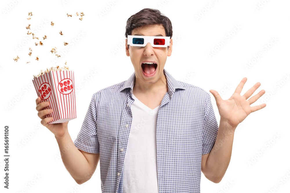 Fototapeta premium Terrified guy with a pair of 3D glasses and popcorn