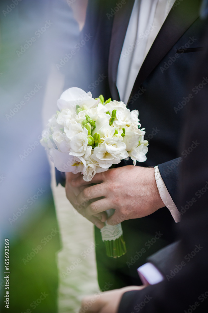 Beautiful bride with bouquet before wedding ceremony Beautiful bride with bouquet before wedding ceremony