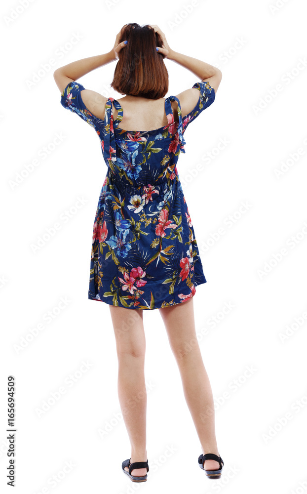 Back view of shocked woman in dress. upset young girl. Rear view people collection. backside view of person. Isolated over white background. The short-haired girl clutched her head. Back view of shocked woman in dress. upset young girl. Rear view people collection. backside view of person. Isolated over white background. The short-haired girl clutched her head.
