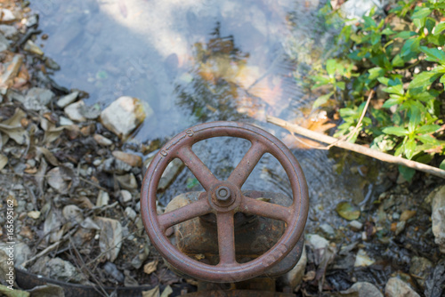 Rusty old water gate. photo