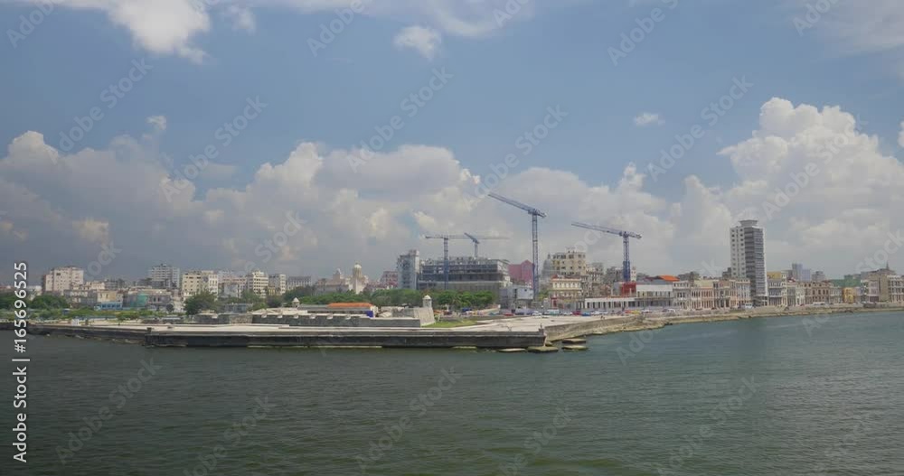 A high angle wide dolly establishing shot of the Castillo de San Salvador de la Punta and the skyline of Havana, Cuba. Shot at 48fps. A high angle wide dolly establishing shot of the Castillo de San Salvador de la Punta and the skyline of Havana, Cuba. Shot at 48fps.