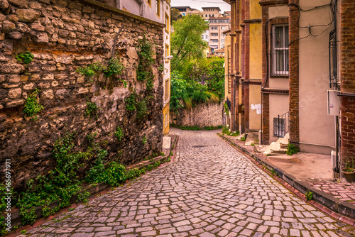 ISTANBUL, TURKEY - May 6, 2017: Vintage view of Traditional street and houses  at balat area.Street view in historical Balat district. Balat is popular attraction in Istanbul. © epic_images