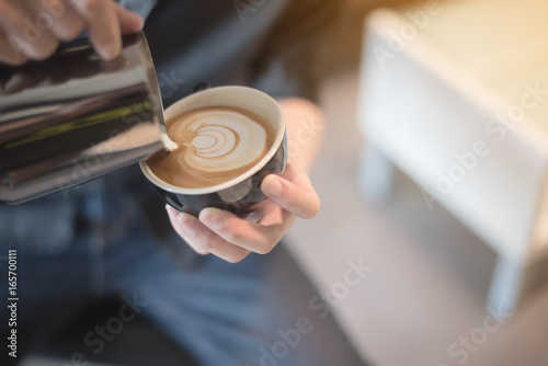 coffee latte art in coffee shop vintage color tone