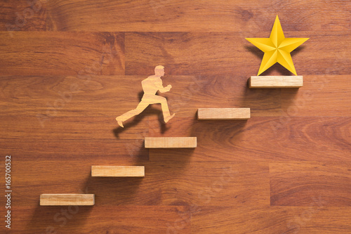 man running on stairs to success photo