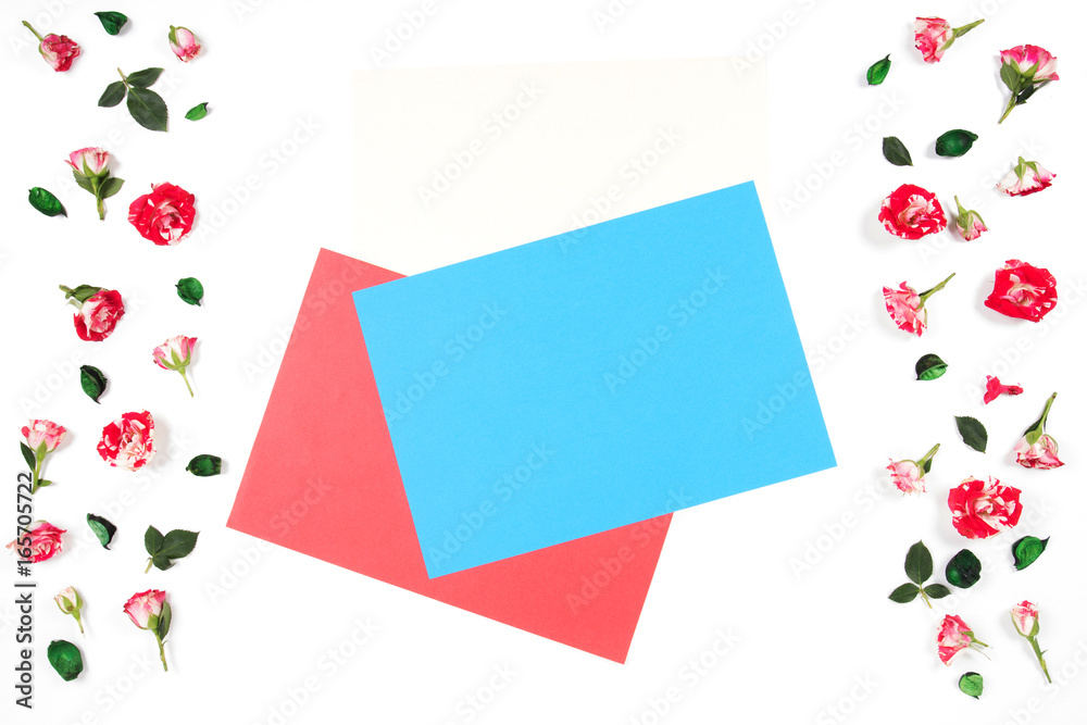 Frame made of rose flowers and empty blank colored paper sheets for text in the middle. Frame made of rose flowers and empty blank colored paper sheets for text in the middle.