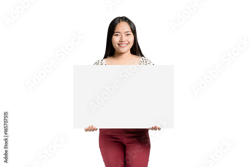 portrait of a beautiful asian woman smiling and holding a blank label in the hands. Isolated on white background with copy space and clipping path