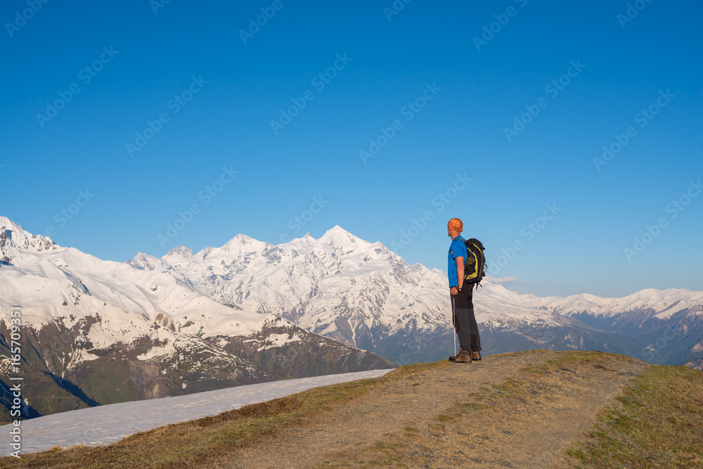 Traveler is standing on the mountain road