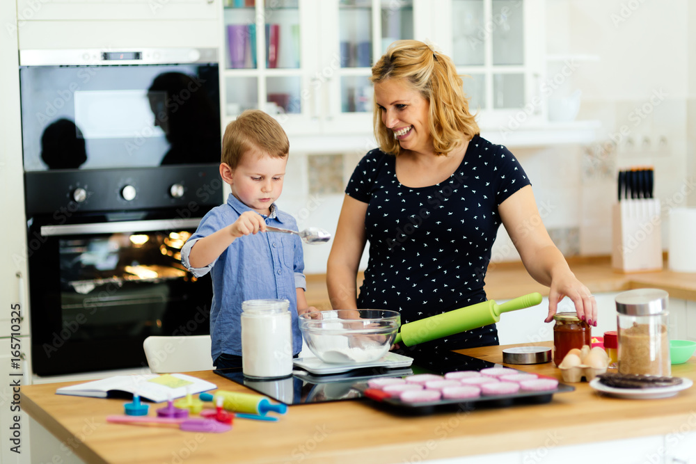 Mother and child preparing cookies
