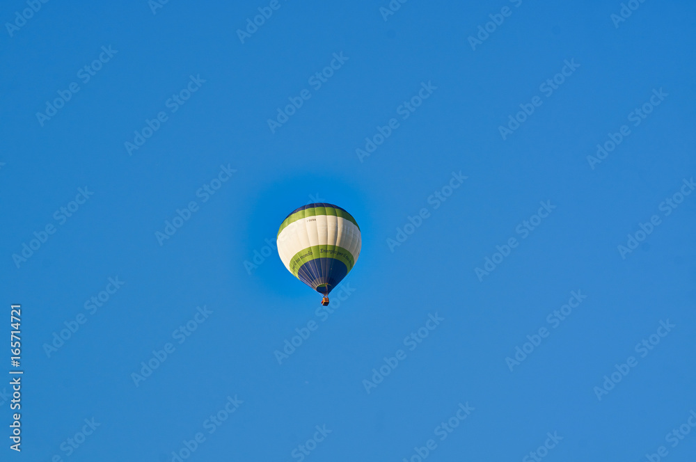 Fototapeta premium Walking balloon and the panorama of the mountains.